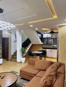 a living room with a couch and a table at North Unit in Asaba