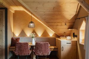 a dining room with a table and two chairs at Hotel Spielmann 4s in Ehrwald