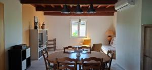 a kitchen and dining room with a table and chairs at Feutres et Formes in Bourg-de-Péage +4 photos