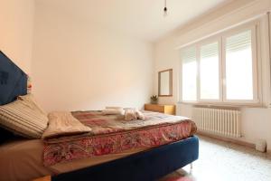 a bedroom with a bed with a stuffed animal on it at Bilocale a 500m dal mare in Giulianova