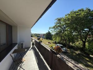 a balcony with a view of a car on a street at Apartmány Adam in Sedlec