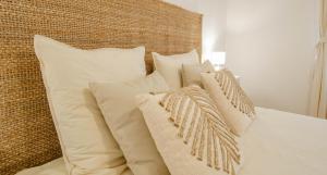 a bunch of pillows sitting on a bed at La bulle champêtre in Balnot-sur-Laignes