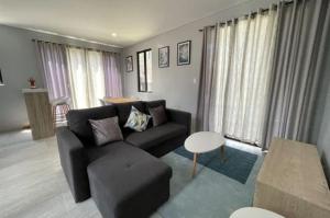 a living room with a couch and a table at house luxury vip in Balayan