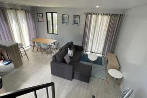 a living room with a couch and a table at house luxury vip in Balayan