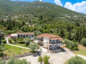 an aerial view of a house with a mountain in the background at Matina Studios in Nikiana