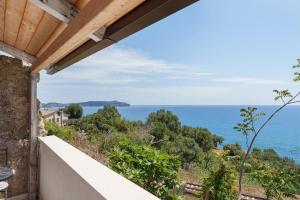 a view of the ocean from the balcony of a house at Tenuta Donna Carmela in Pisciotta