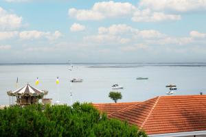 a view of a large body of water with boats in it at Hôtel Le B d'Arcachon by Inwood Hotels in Arcachon