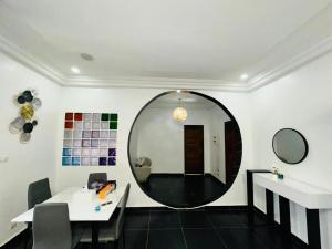 a room with a large mirror on the wall at Chez sesa in Dakar