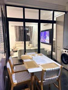 a living room with a table and a couch at Chez sesa in Dakar