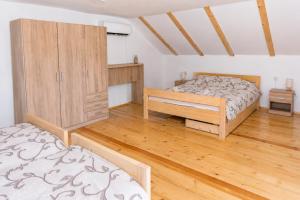 a bedroom with two beds and a cabinet at River Valley Guest House in Foča +10 photos