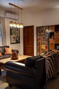 a living room with a couch and a table at Loman Art in Dakar