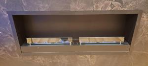 a shelf in a wall with blue candles in it at Valdora Forest Oasis - Spa Villa Fužine in Fužine