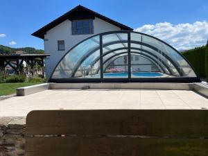 a building with a glass dome on top of a patio at Ferienwohnung Frisch in Lam
