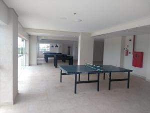 a room with two ping pong tables in it at SALINAS PARCK in Salinópolis