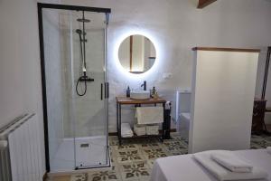 a bathroom with a shower and a sink and a mirror at Masía El Losar - Casa Rural Exclusiva Castellón in Villafranca del Cid +29 photos