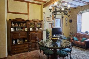 a living room with a table and a couch at Masía El Losar - Casa Rural Exclusiva Castellón in Villafranca del Cid