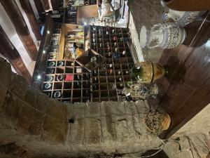 an overhead view of a wine tasting room with wine bottles at Masía El Losar - Casa Rural Exclusiva Castellón in Villafranca del Cid