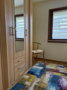 a room with a door and a window and a rug at Ferienhäuser Holenberg in Holenberg