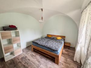 a bedroom with a bed in a room at Apartmán 56 in Božanov