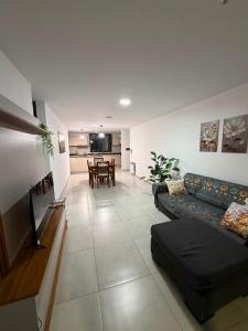 a living room with a couch and a table at Amalfi Apart in Villa María