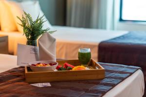 a tray of food on a table in a hotel room at Planalto Bittar Hotel e Eventos in Brasília