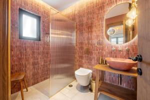a bathroom with a bowl sink and a mirror at Casa Tortuga - Exclusive Villa Corfu in Acharavi +43 photos