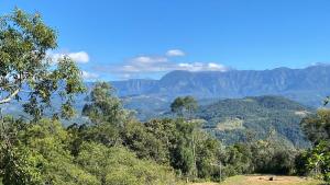 a view of a valley with mountains in the background at NOVIDADE - Cabana Refúgio Gaia in Annitapolis