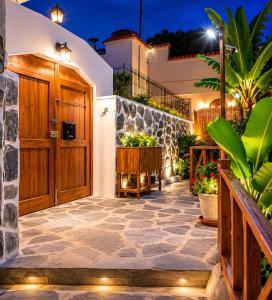 a front door of a house at night with lights at TenoHomes La Era de Catuja Getaway in Los Realejos