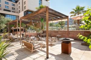 a pavilion with chairs and tables on a patio at Renaissance Aix-en-Provence Hotel in Aix-en-Provence