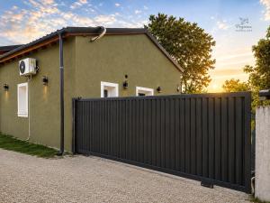 a house with a gate in front of it at Pegasus Pool Villas Kavala in Kavála