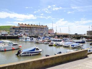 a marina filled with lots of boats in the water at Sea Drift in West Bay +7 photos