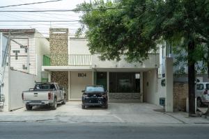 a truck parked in front of a house at Casa Verde in Monterrey