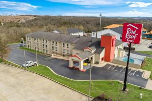 a rendering of a red roof hotel with a red sign at Red Roof Inn Branson in Branson