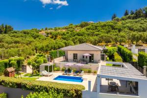 an aerial view of a house with a swimming pool at Villa Vatia 2 in Tragaki