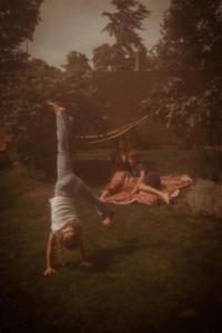a painting of three people laying in the grass at Maison Bellefleur B&B - Pension in Renesse