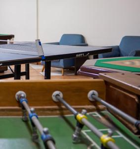 a ping pong table with a ping pong ball on it at Serra Negra Paladium Hotel in Serra Negra