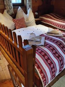 two twin beds sitting next to each other at Chalet "Knusperhäuschen" in Murau +72 photos