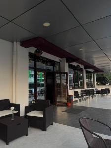 a building with chairs and tables and aasteryasteryasteryasteryasteryasteryasteryastery at Hotel Ibiza in Eforie Nord