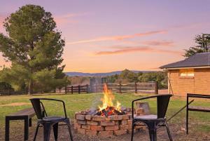 two chairs and a fire pit in a yard at Blue Willow Bathurst Country Getaway in Bathurst