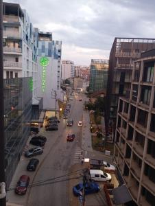 a view of a city street with cars and buildings at Paradise apartament in Prishtinë