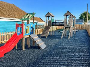 a playground with a slide and a slideintend at Sunshine & Smiles in South Hayling