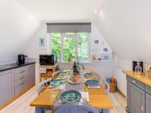 a kitchen with a table with plates on it at Valley Lodge - Uk49228 in Gunnislake