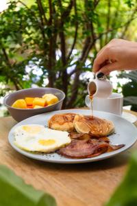 a plate of breakfast food on a table at Blues Suites Medellín in Medellín