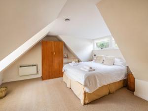 a bedroom with a bed in a attic at Faodail in Plockton