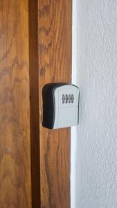 a black and white object is attached to a wall at Ferienhaus - Hoamathaus in Aigen im Ennstal +42 photos