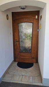 a wooden door with a window in a hallway at Ferienhaus - Hoamathaus in Aigen im Ennstal
