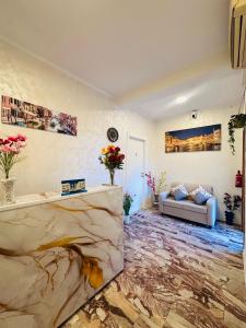 a living room with a couch and a marble floor at Alisa house Venice in Venice +44 photos