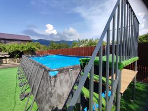 a slide in a yard with a swimming pool at Eva Guesthouse in Odzun