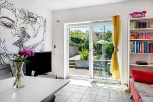 a living room with a couch and a window at Feriendomizil Brunnenberg in Sipplingen