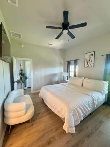 a bedroom with a bed and a ceiling fan at Tombstone Casa in Abilene